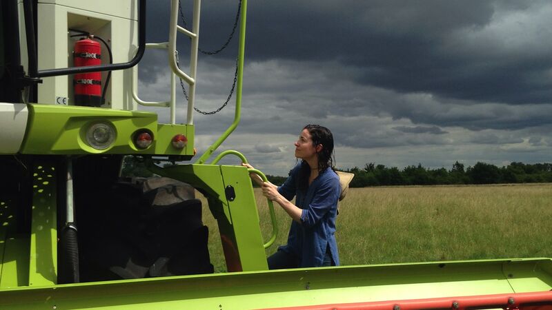 An image of Helen Anne Curry holding a pumpkin