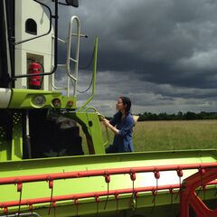 An image of Helen Anne Curry holding a pumpkin