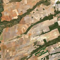 European Space Agency Sentinel 2A image of Brazilian farms from space. From ESA: "Here we can see a large, flat plateau blanked with fields benefiting from rich soils and an apparent abundance of water, before falling off into a green, hilly valley (left)